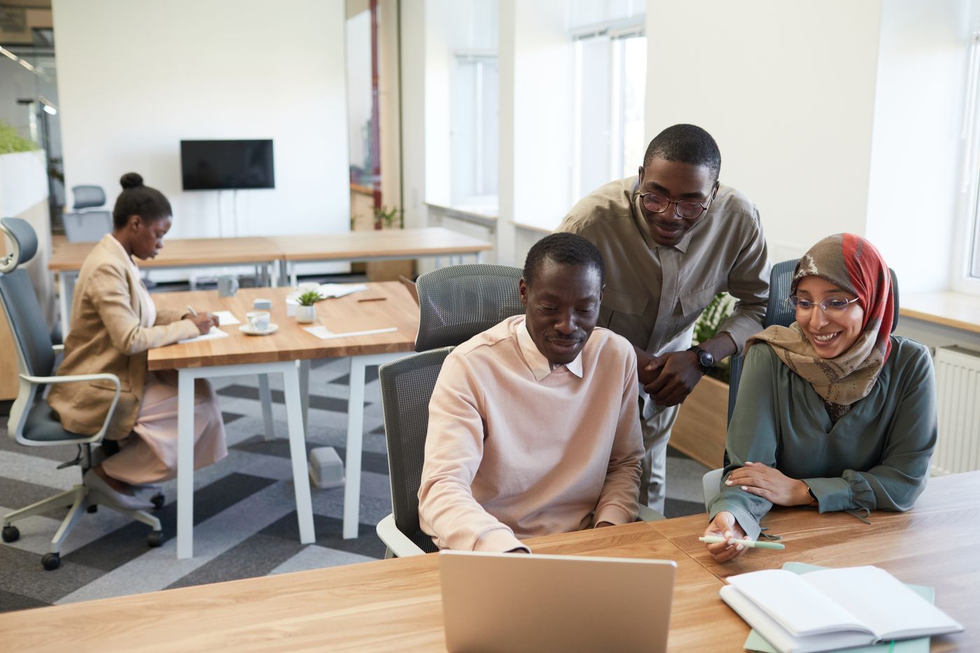 Colleagues collaborating in a modern office
