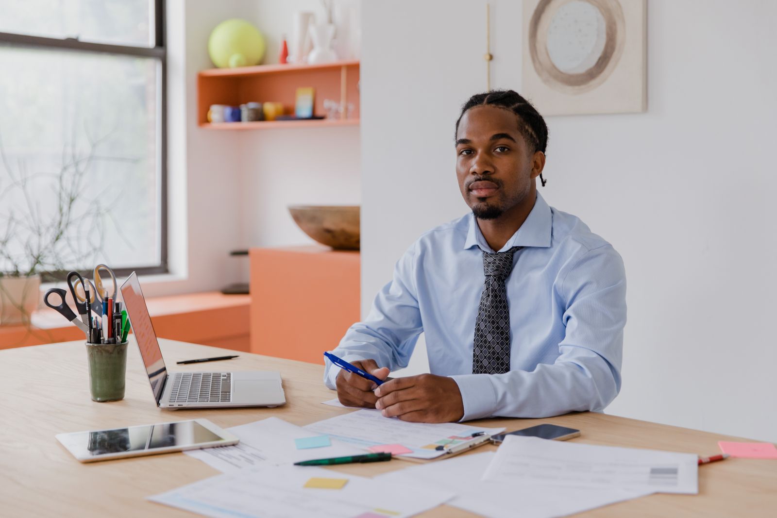 A South African professional working at his desk